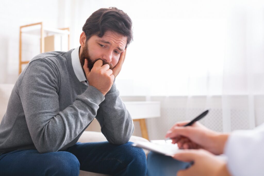 Millennial man with depression during psychotherapy session